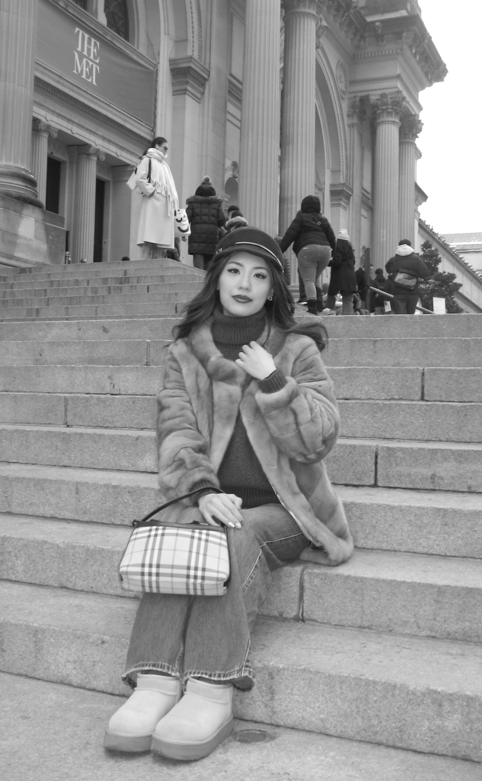 Maysnow on the steps of the Met museum in NYC